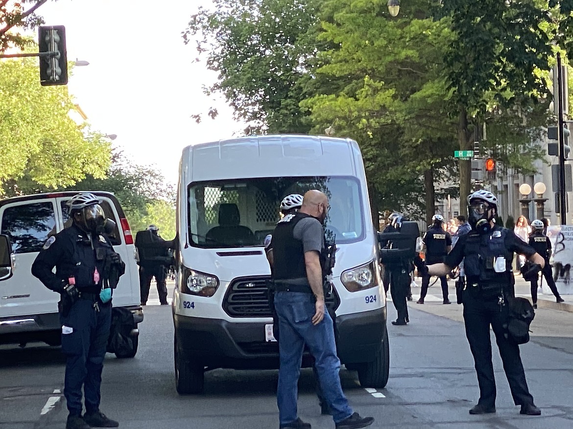 Law enforcement stand ready to respond in Washington, D.C. Monday.