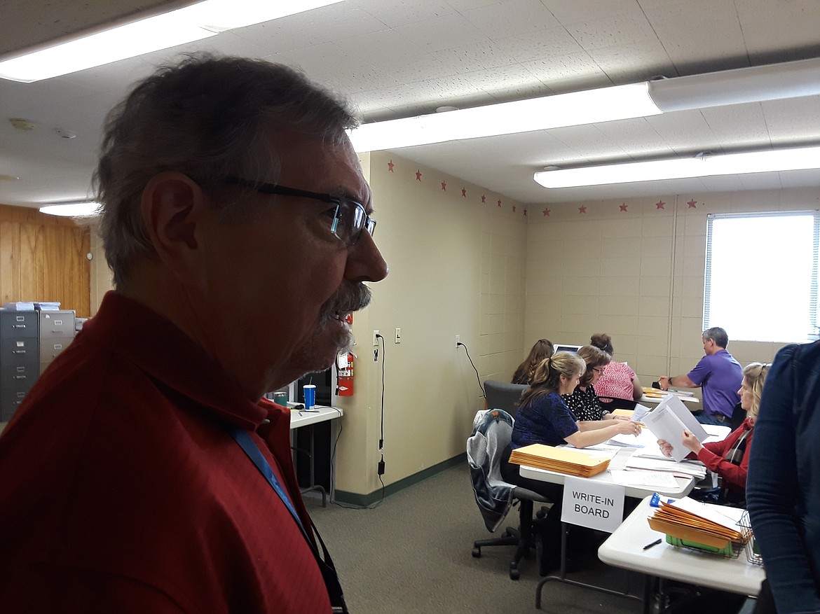 Kootenai County Clerk Jim Brannon looks on as his staff processes in-bound votes Tuesday afternoon. The Elections Office counted 32,800 votes in total after sending out more than 42,000 ballots to citizens across Kootenai County. (CRAIG NORTHRUP/Press)