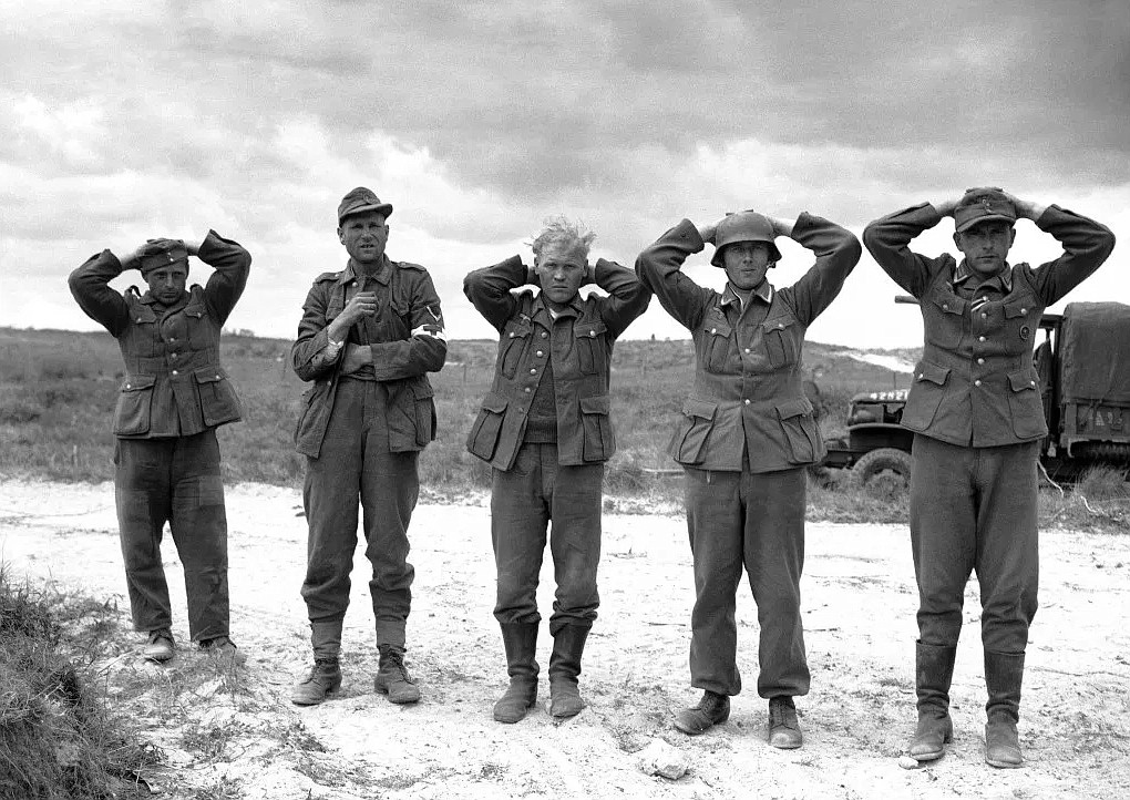 GOOGLE IMAGES 
 German soldiers surrendering on June 9, 1944, in Normandy where Tech Sergeant Frank G. Peregory of Virginia captured 30, earning a Medal of Honor.