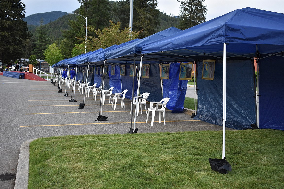 (Photo by DYLAN GREENE) 
 Each graduate sat under a canopy during the graduation.