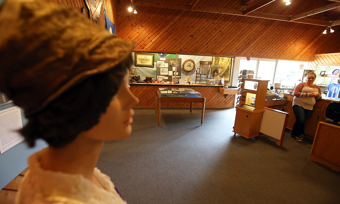 Volunteer Katrina Cook stands behind the front counter of the Museum of North Idaho on Friday morning.