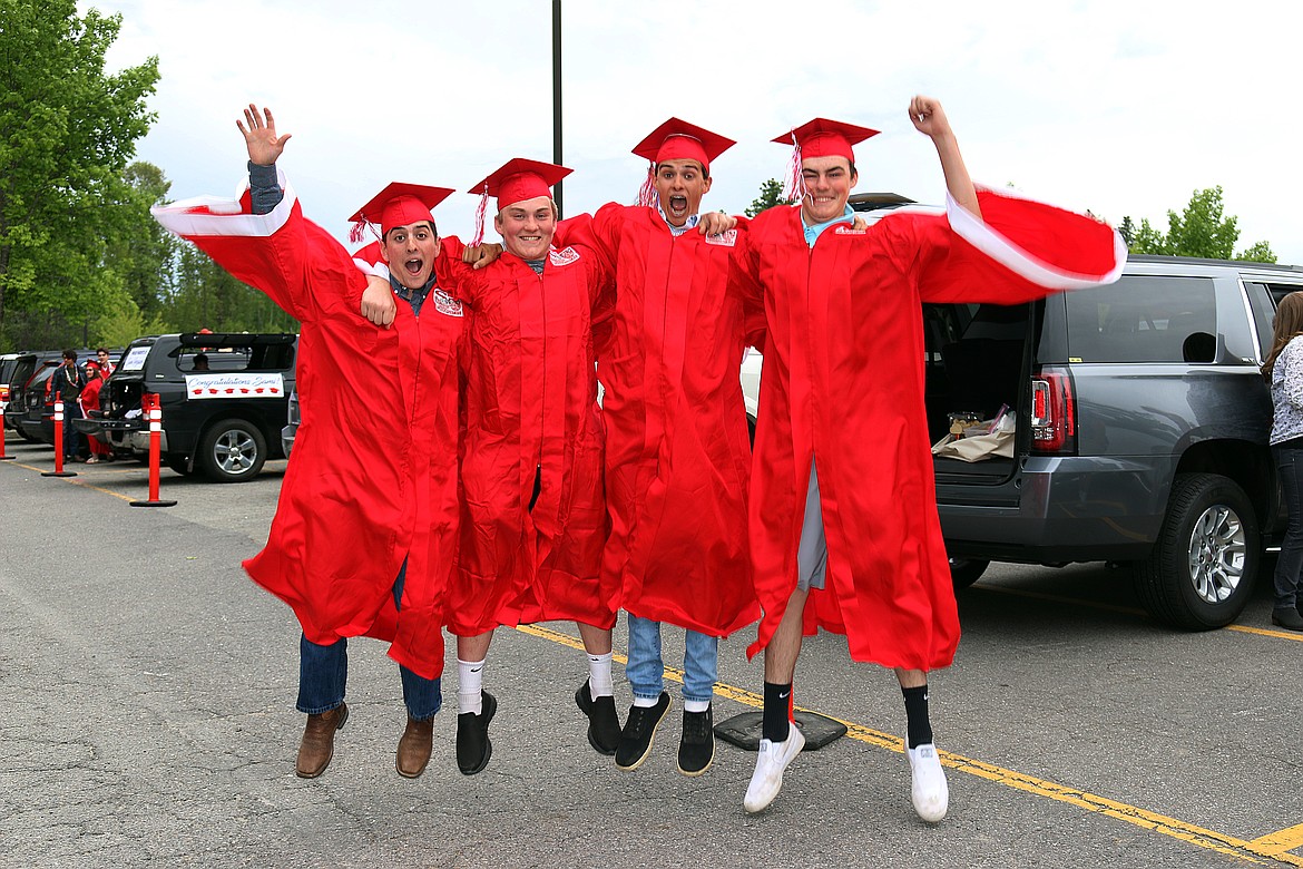 A quartet of Sandpoint High School graduates jump for joy at Friday’s commencement ceremony.