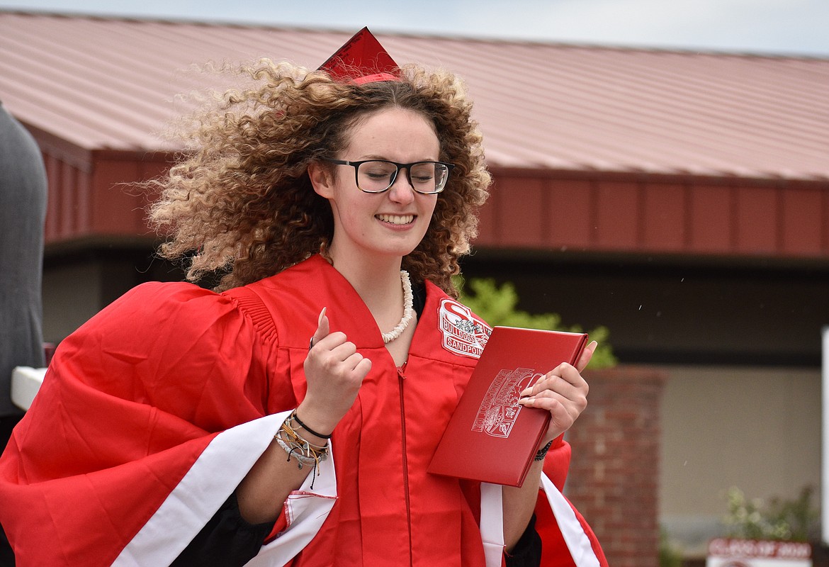 (Photo by DYLAN GREENE) 
 An SHS grad is pumped after crossing the graduation stage.