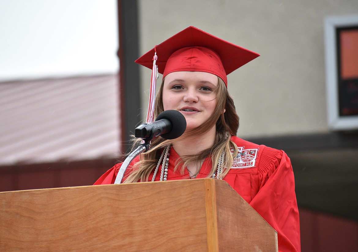 (Photo by DYLAN GREENE) 
 Senior class president Savannah Morgan delivers her graduation speech.