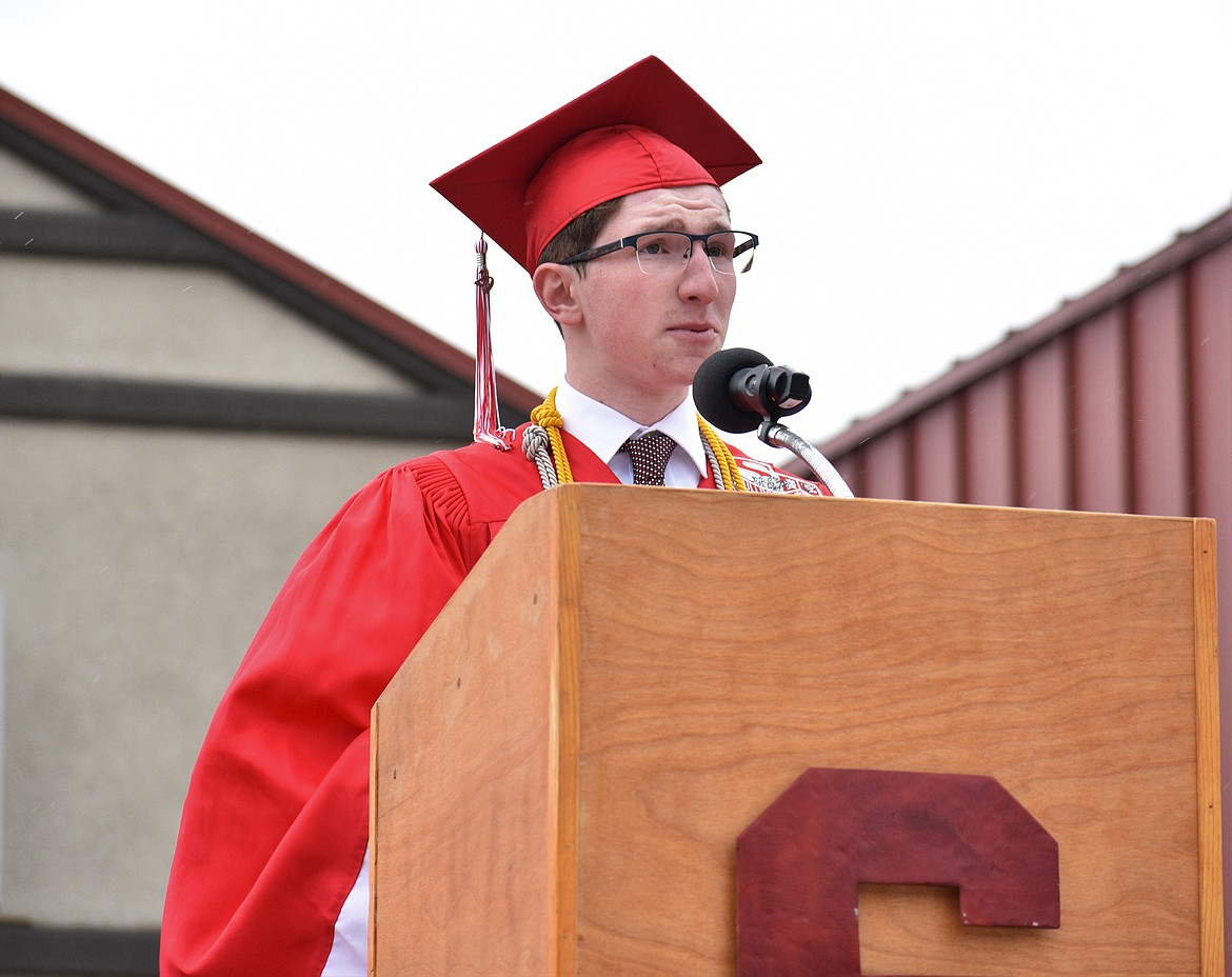 (Photo by DYLAN GREENE) 
 Co-valedictorian Nate Couch delivers his commencement speech.