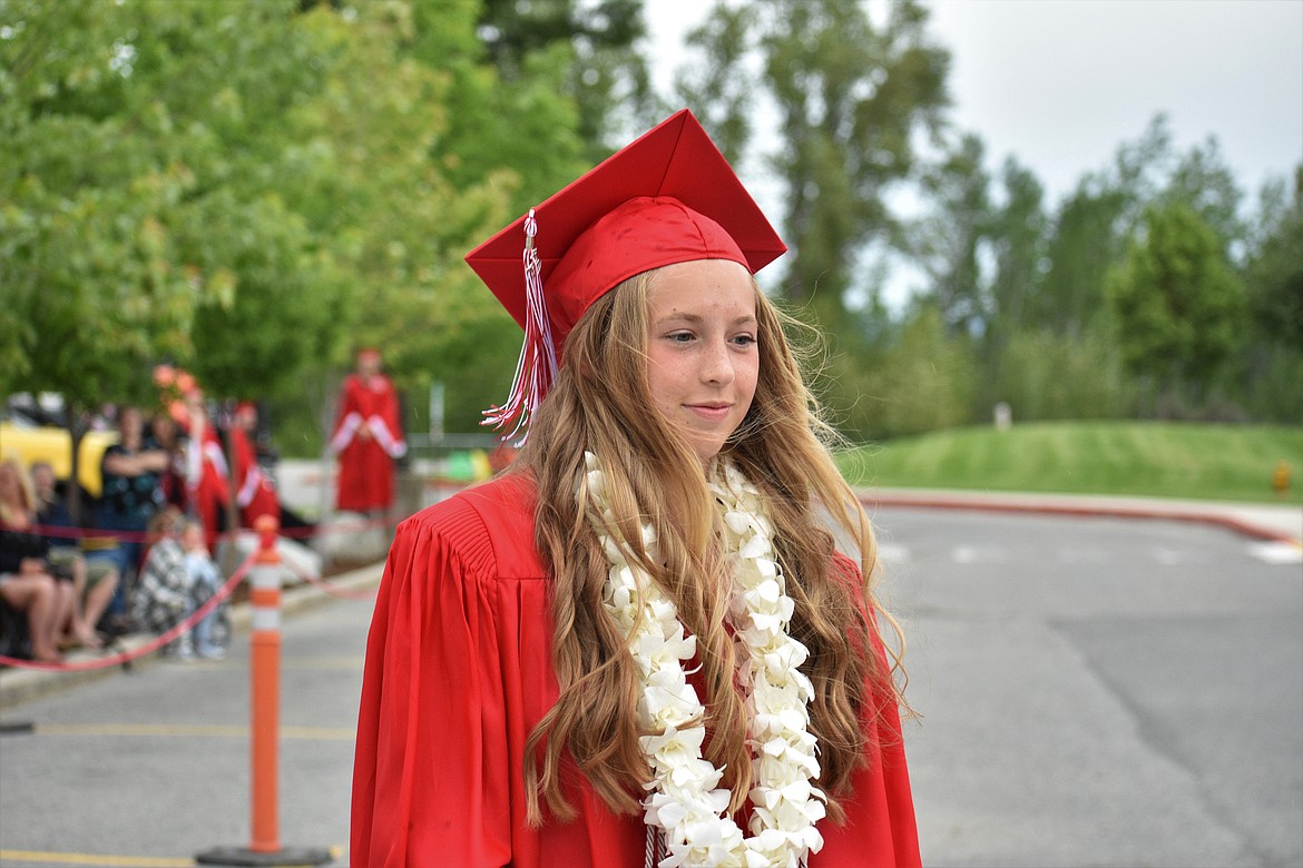 (Photo by DYLAN GREENE) 
 Paige Davidson walks up to deliver her salutatorian speech.