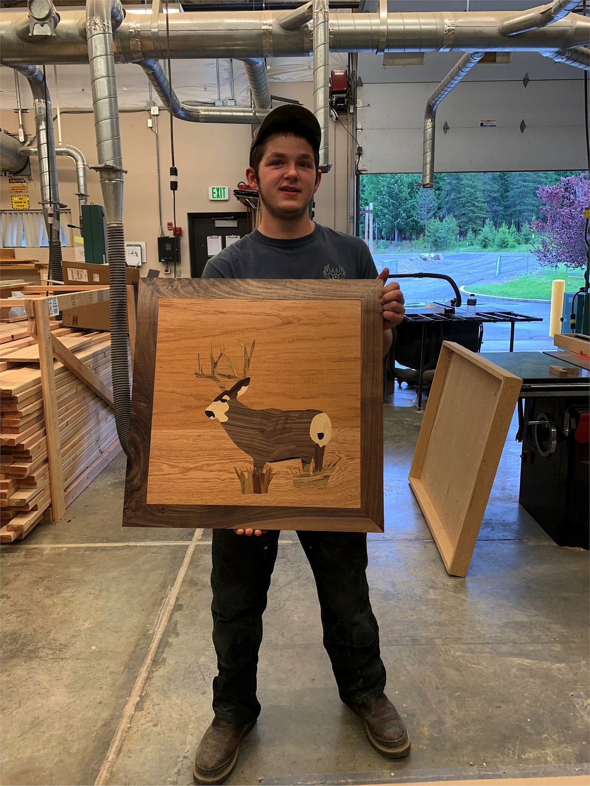 Cody’s veneered panel top for his first semester cabinet project. He used black walnut as the trim and a variety of wood veneers to create the deer. The deer is based off of an image he was able to capture from one of his game cameras. The deer was known famously around the shop as “the one that got away.”