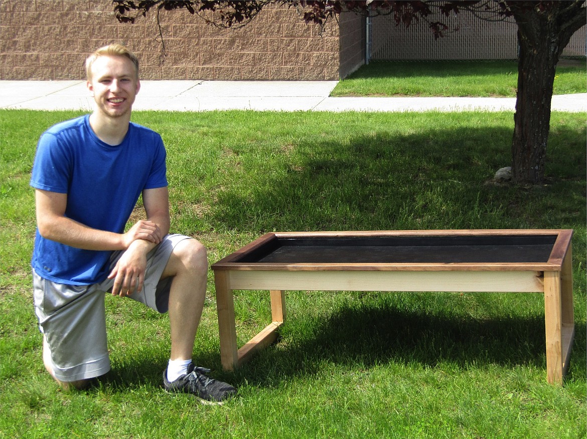 Justin Mendenhall and his modern coffee table. He used hard maple for the legs, alder for the aprons, and black walnut for the top trim. He is planning to have class inset on the top and use the inside like a shadow box.