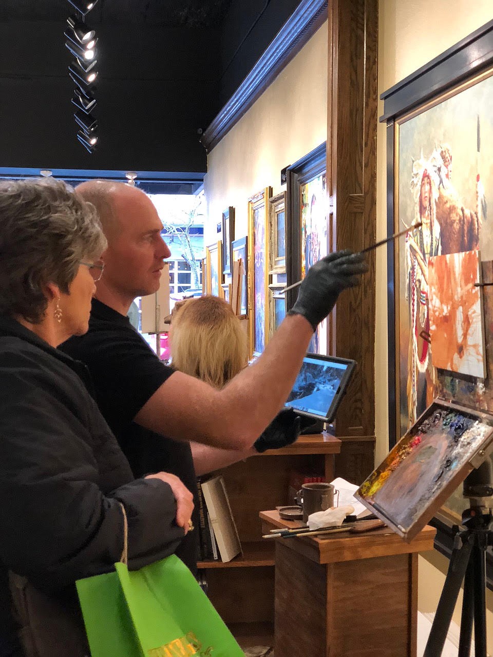 Kyle Paliotto conducts a painting demonstration in Coeur d’Alene Galleries during an ArtWalk last year. The Coeur d’Alene Arts and Culture Alliance has announced the 2020 lineup for summer events and concerts, which will be held with safety measures in place. (Courtesy photo)