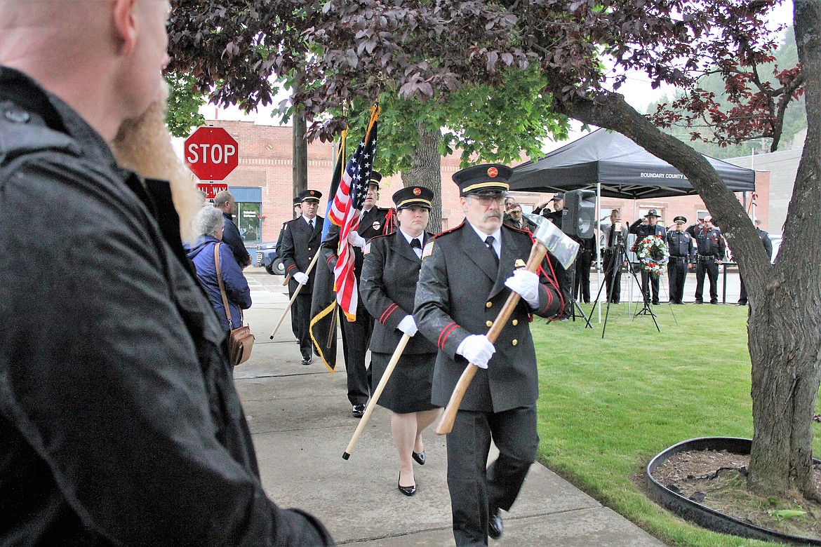 (Photo by TONIA BROOKS) 
 Community members braved the rain to pay tribute and honor the 147 law enforcement officers and 28 K9 officers who died in the line of duty during 2019.