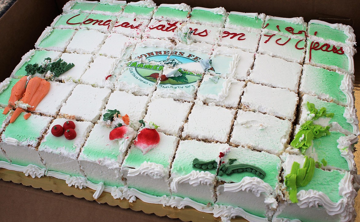 (Photo by TONIA BROOKS) 
 Guests to the Saturday, June 6 Farmers Market were treated with a piece of celebratory cake and refreshments along with periodic raffles for market items that lasted throughout the day.