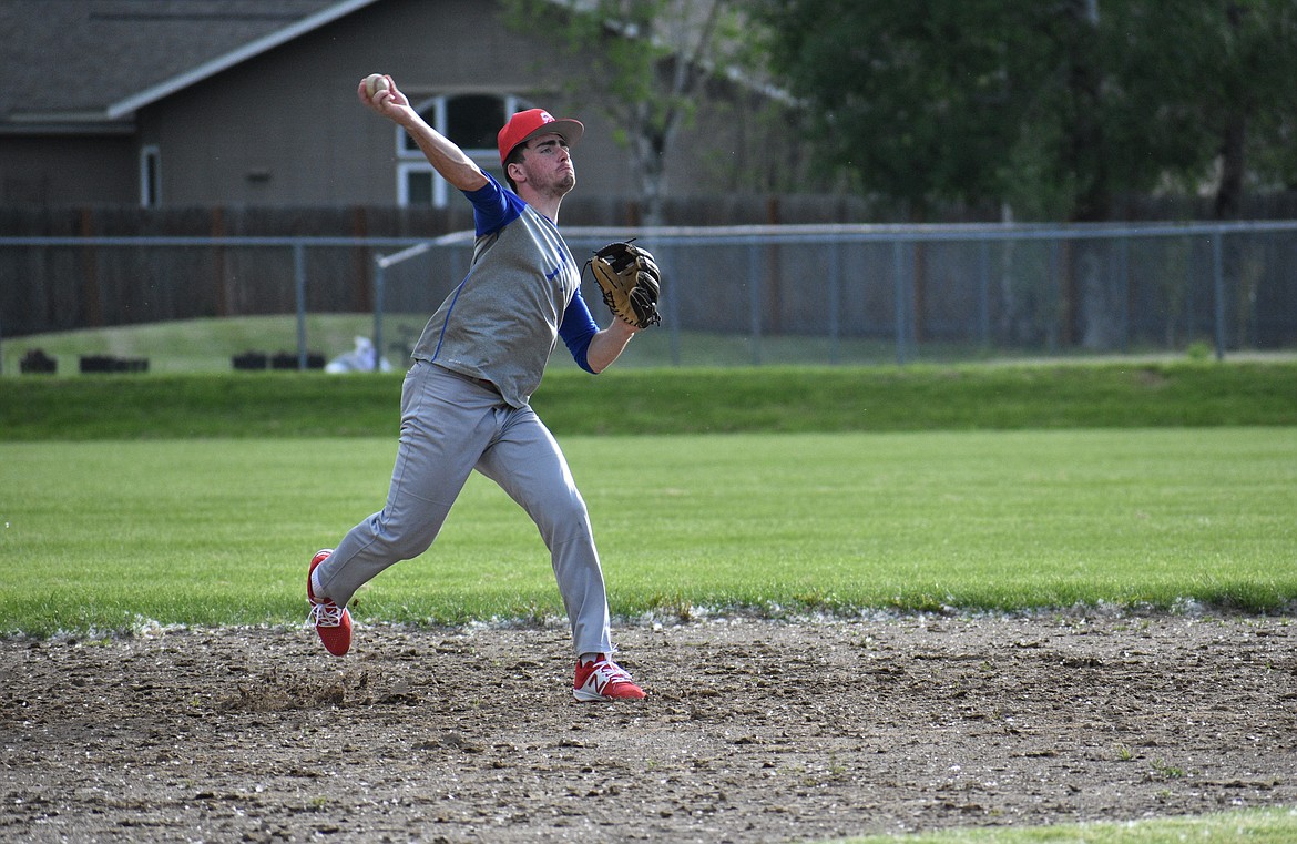 U19 player Cameron Garcia tosses a ball toward first base on Wednesday.