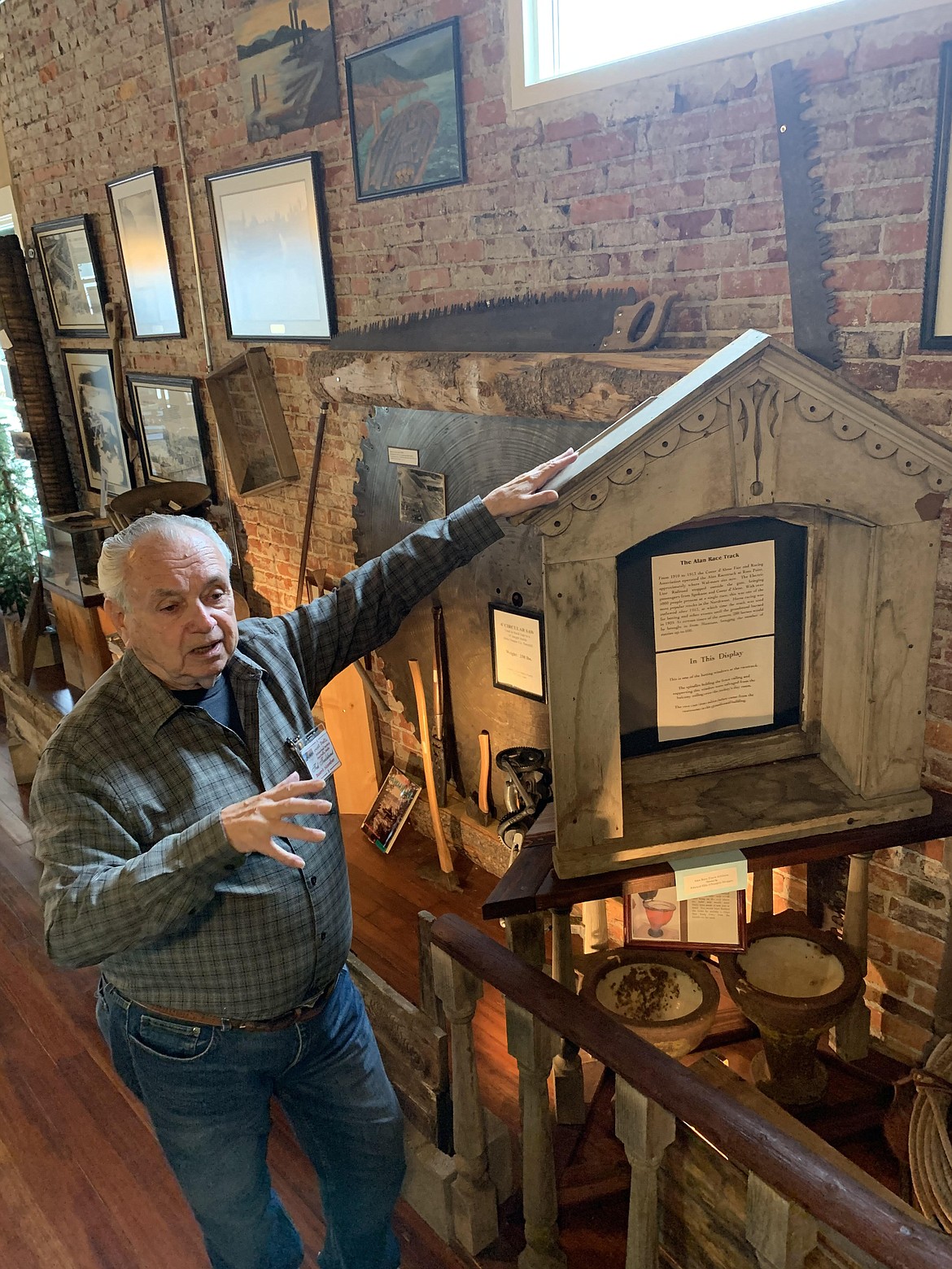 Post Falls Historical Society board member Ted Fredekind stands by a betting window from the Alan Race Track that was used from 1910 to 1913. It was located where the Walmart sits now on Mullan Avenue.