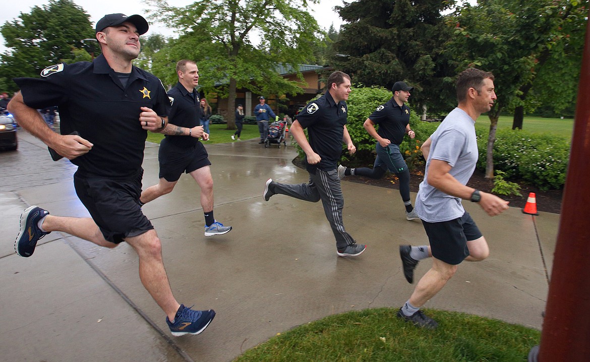 Members of the Idaho State Police start out in the ISP 5K Foot Pursuit at McEuen Park on Saturday morning.
