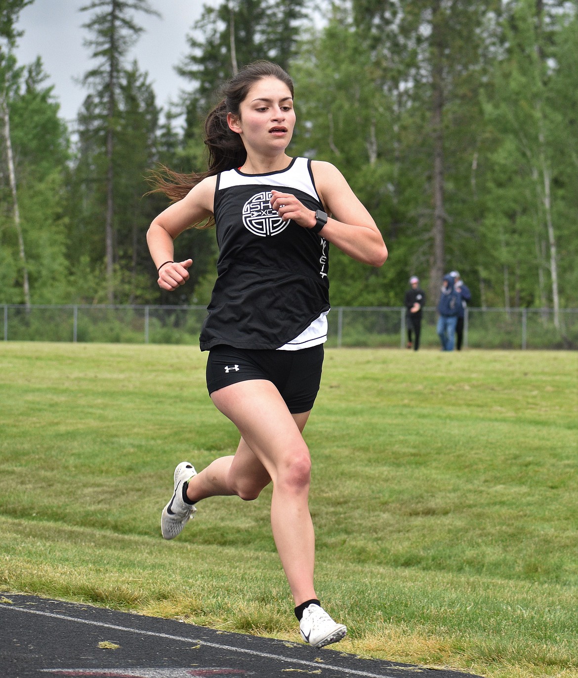 (Photo by DYLAN GREENE) 
 Sandpoint senior Bionce Vincent crosses the finish line in first in the girls 1,600 meter.