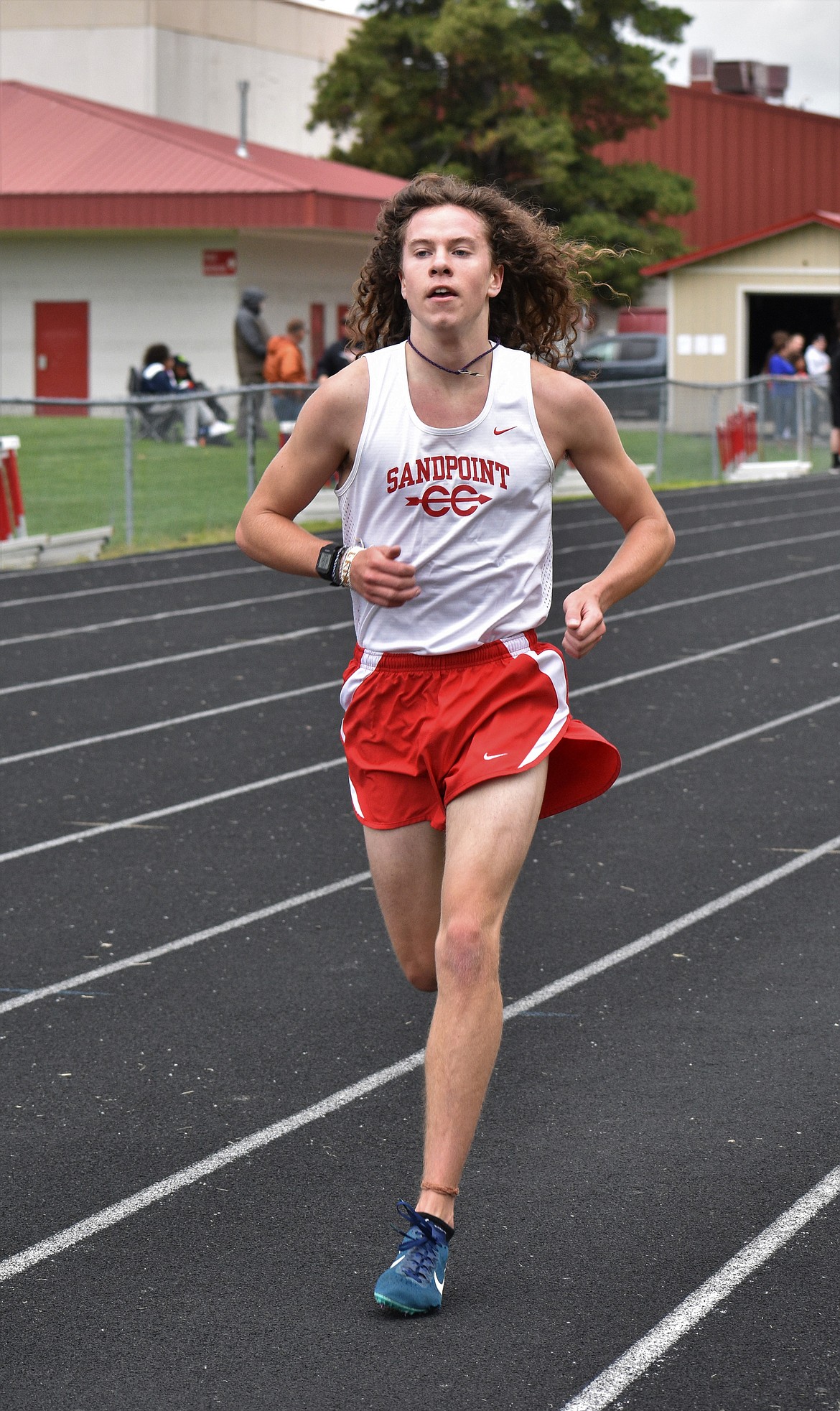 (Photo by DYLAN GREENE) 
 Junior Jett Lucas competes in the boys 3,200 meter.
