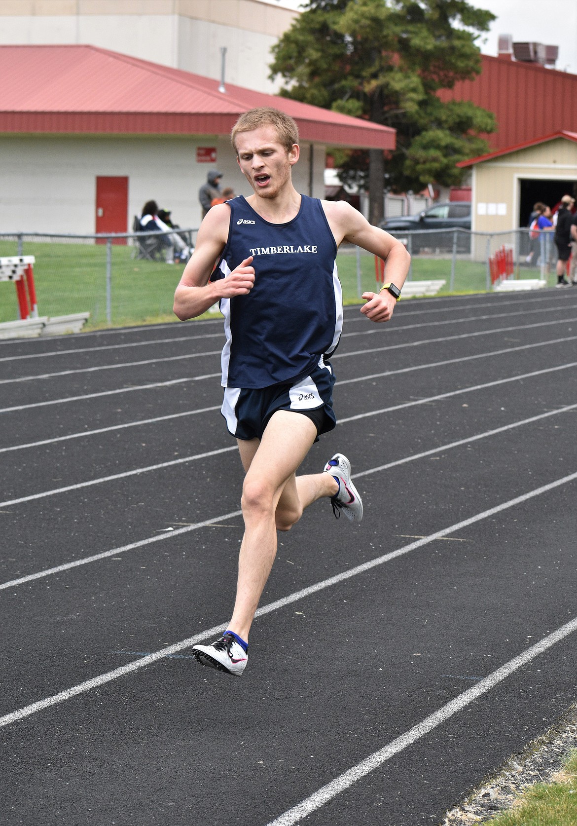 DYLAN GREENE/Bonner County Daily Bee 
 Timberlake senior Logan Hunt nears the finish line in the boys 3,200 meters at the Sandpoint Open on Saturday. He won the event with a time of 9:42.91.