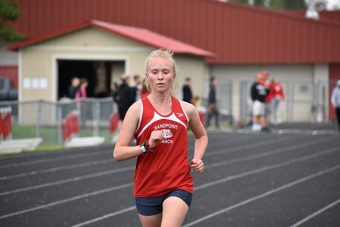 (Photo by DYLAN GREENE) 
 Sandpoint sophomore Mackenzie Suhy-Gregoire runs in the girls 3,200 meter on Saturday.