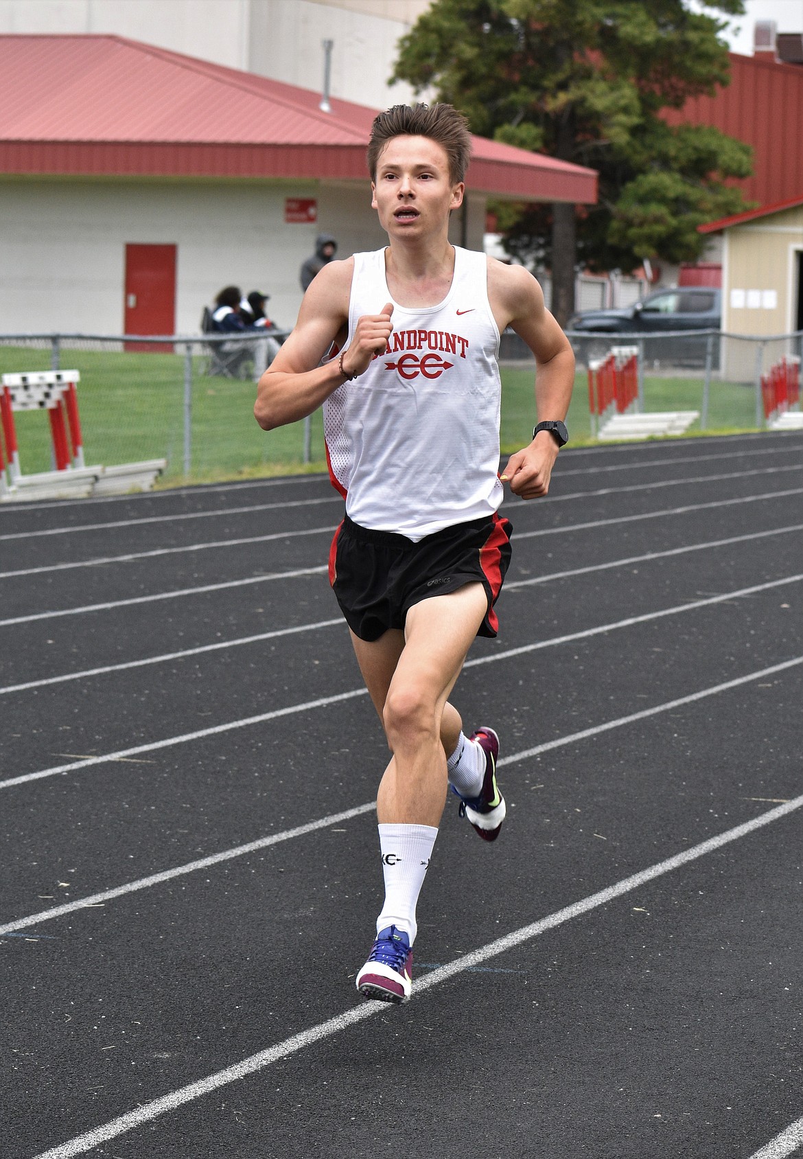 (Photo by DYLAN GREENE) 
 Junior Nikolai Braedt nears the finish line in the boys 3,200 meter.