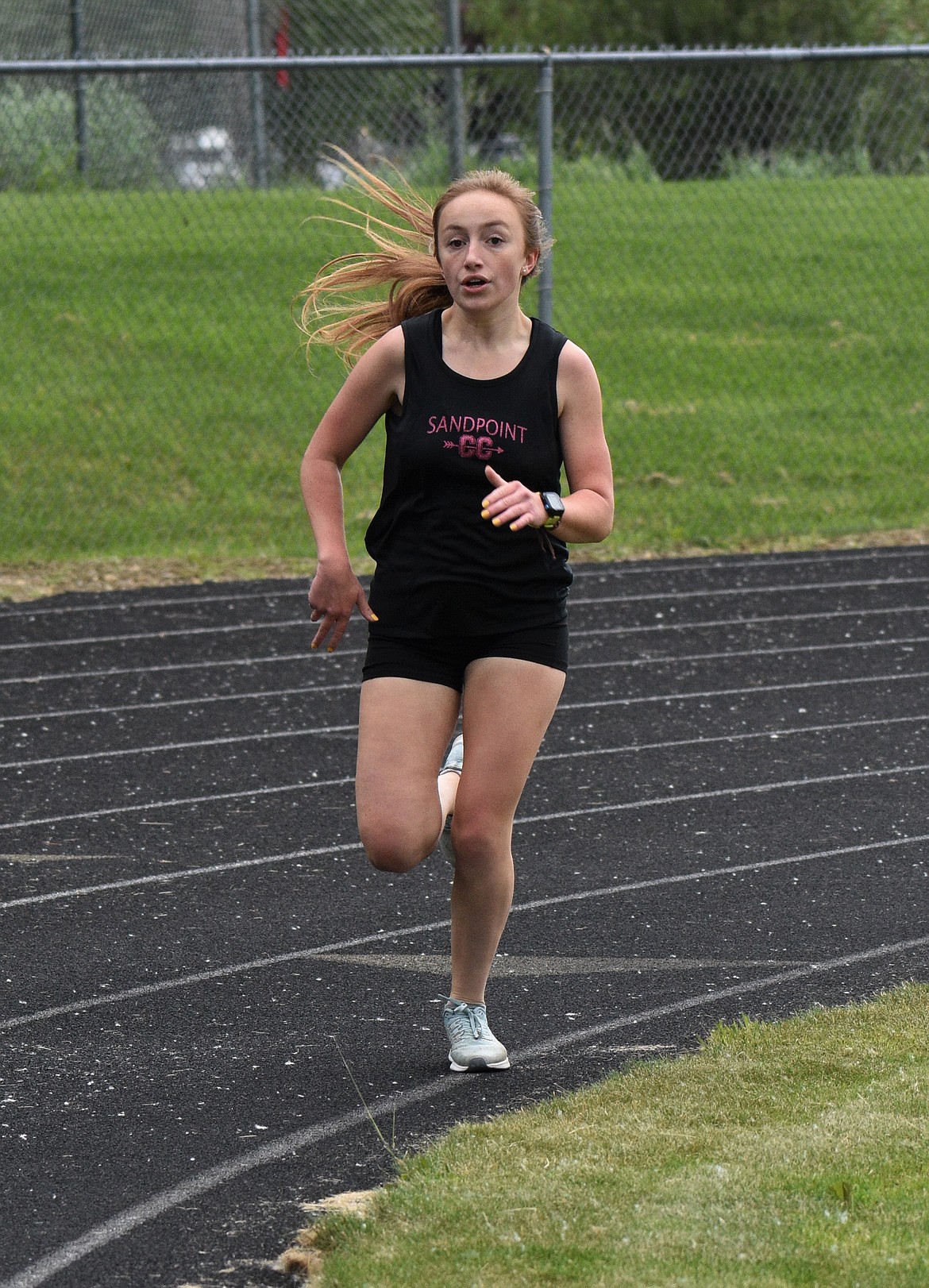 (File photo by DYLAN GREENE) 
 Camille Neuder runs in the Sandpoint Open in June. Neuder is one of the two captains on the girls side this season and she hopes to leave the program better than she found it.