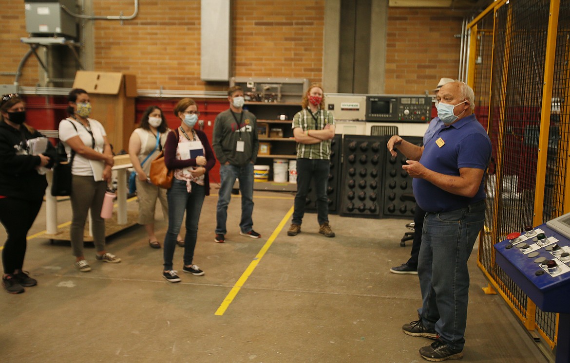 University of Idaho associate professor Robert Rinker, right, describes the many opportunities the university offers computer science students during a robotics demonstration Wednesday. U of I Coeur d’Alene will offer Idaho’s first bachelor’s degree in cyber security, as well as a new industrial technology program previously just offered in Idaho Falls.