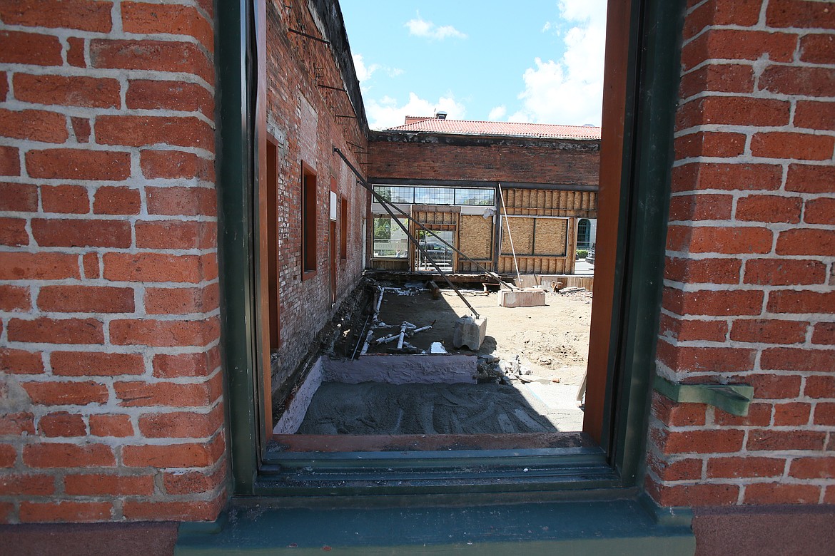 Rubble and debris are being removed from the old brick building at the northeast corner of Lakeside Avenue and Fourth Street as crews prepare to rebuild on the site. A fire destroyed the building and displaced several businesses in January. (DEVIN WEEKS/Press)