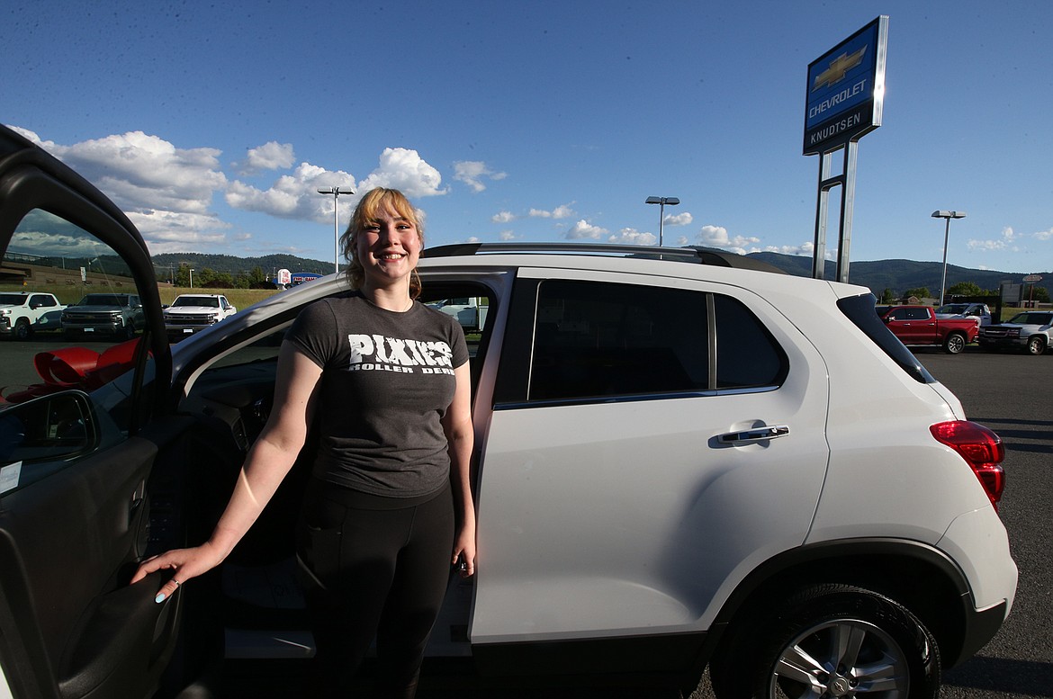 BILL BULEY/Press 
 BILL BULEY/Press 
 Amy Palmer smiles as she poses with the 2019 Chevy Trax she won Thursday at Knudtsen Chevrolet in Post Falls.