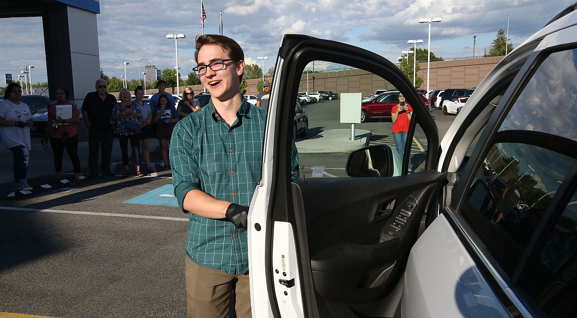 BILL BULEY/Press 
 Brian Hansen smiles after winning the 2019 Chevy Trax Thursday at Knudtsen Chevrolet in Post Falls.