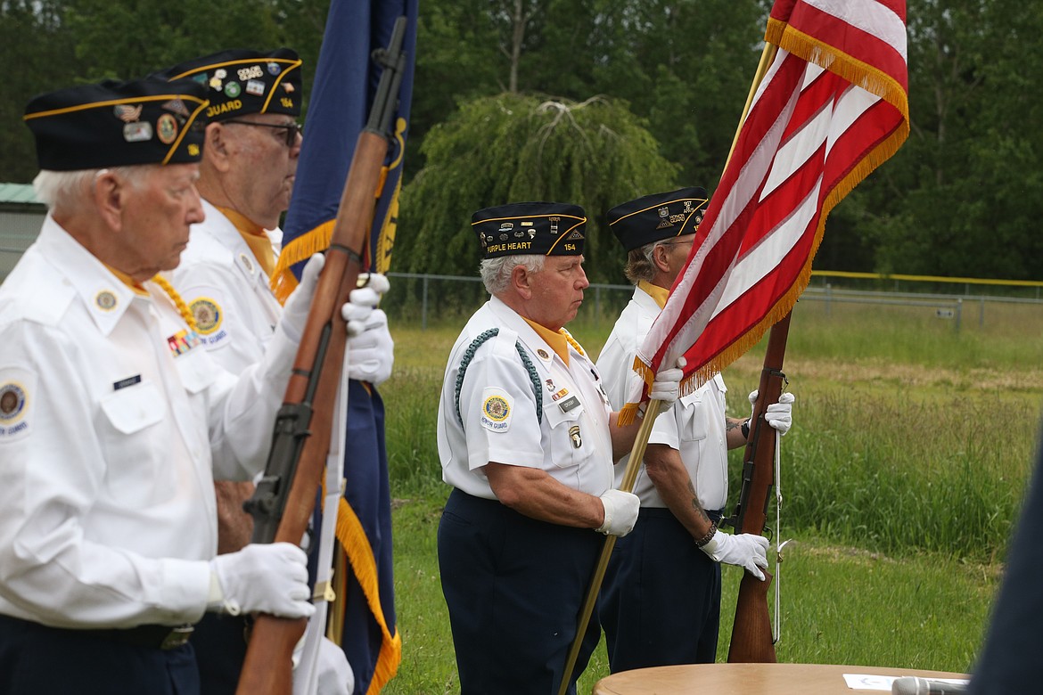 BILL BULEY/Press 
 The Honor Guard, from left, Hal Donahue, Bob Kernen, Len Crosby and Todd Halvorson, take part in the flag retirement ceremony on Saturday at the Rathdrum Lions Club.