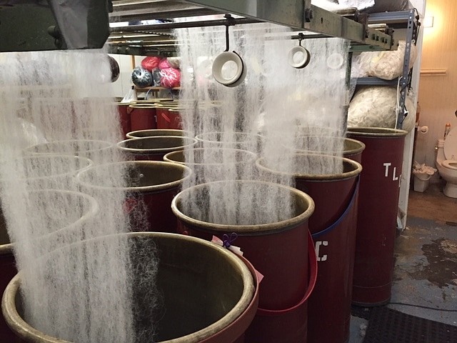 During the process of fiber being turned into roving (which will then be spun into yarn).