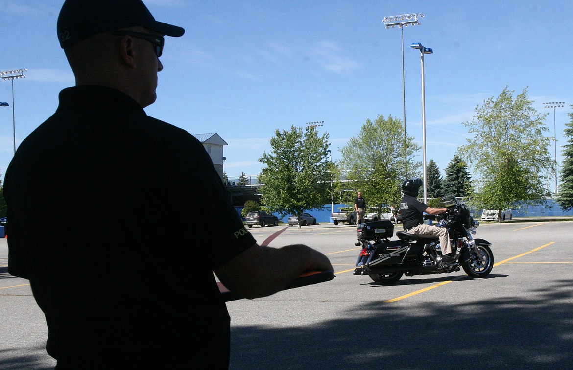 Sgt. Shane Avriett of the Coeur d’Alene Police is one of a couple motorcycle police instructors in North Idaho. He watches as Todd McDevitt of Idaho State Police maneuvers through a course.
Ralph Bartholdt/Press