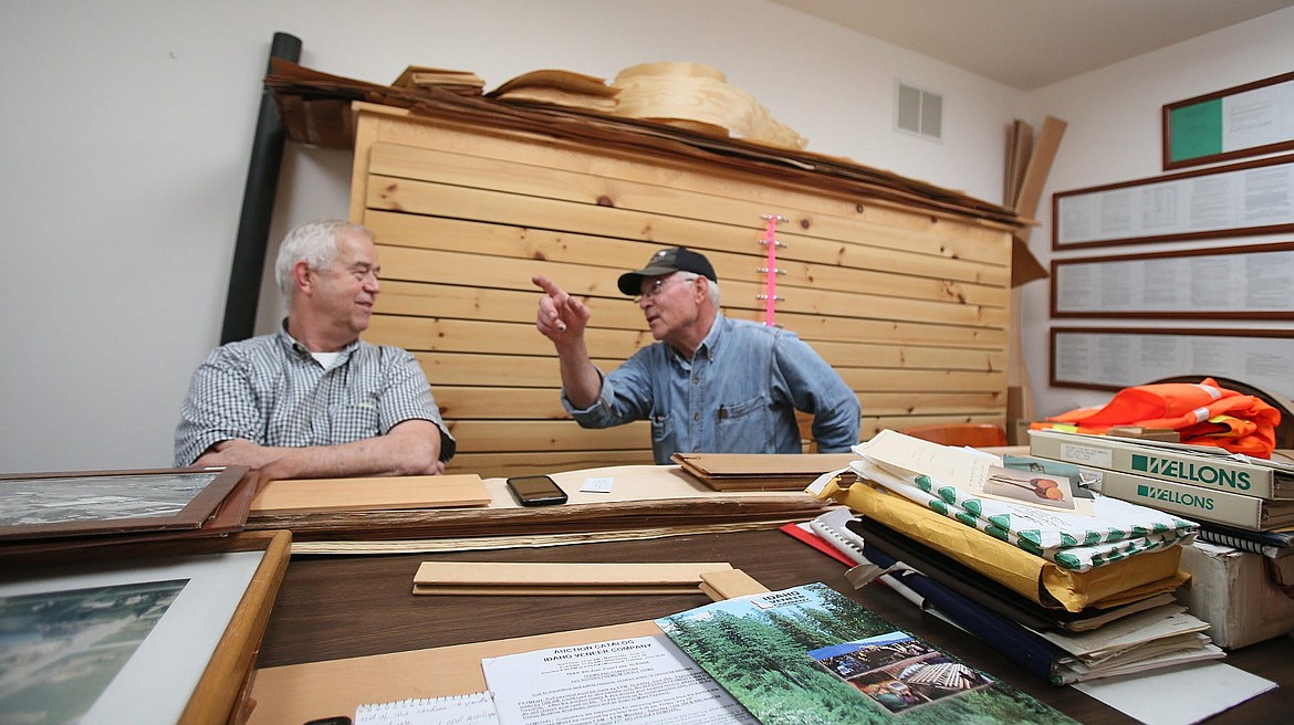 Idaho Veneer Company co-owners and brothers John, left, and Pat Malloy discuss a few memories from their lives working together at the iconic Post Falls business during an interview Tuesday. Idaho Veneer, which sliced white pine for veneers and produced other lumber items, will be closing this summer after nearly 70 years. (DEVIN WEEKS/Press)