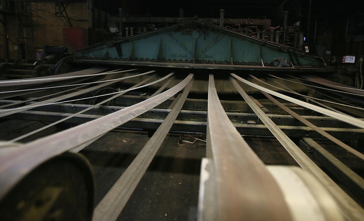 This wood slicer that creates thin sheets of wood veneer is one of countless items Idaho Veneer Company auctioned off this week as it prepared to close its doors. (DEVIN WEEKS/Press)