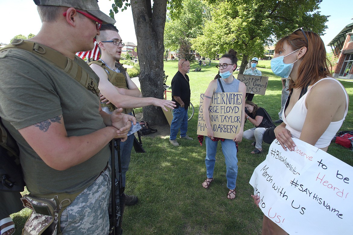 BILL BULEY/Press 
 Gabbie Dunn, second from right, and Katie talk with Mason Deacon, left, and Cole at McEuen Park on Tuesday.