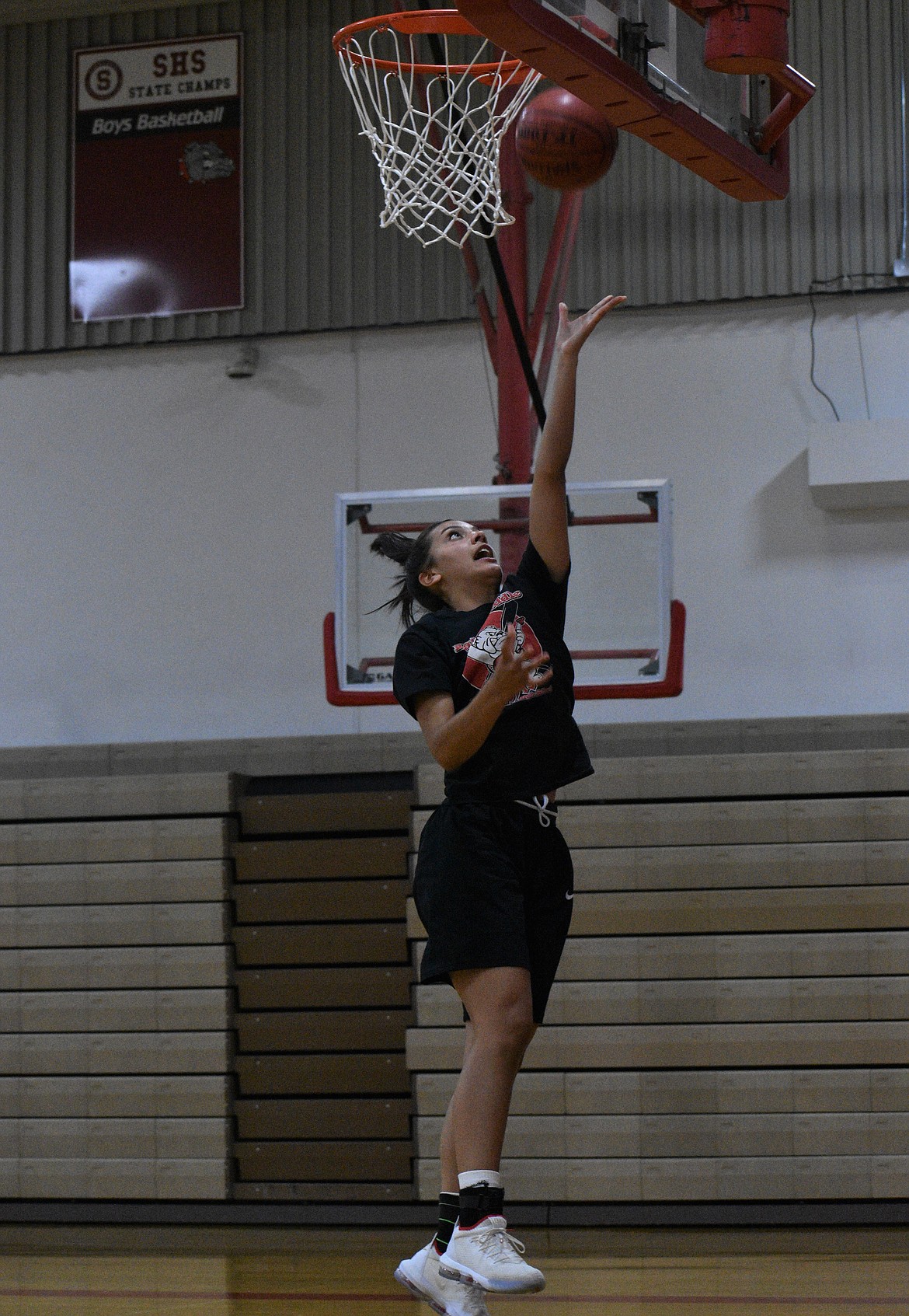 (Photo by DYLAN GREENE) 
 Bella Phillips drives to the hoop for a layup during practice on Wednesday at Les Rogers Court.