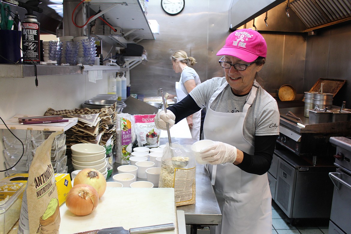 Debra Polito prepares “overnight oatmeal” to be delivered to Meals to Heal clients. The program, which provides meals for cancer patients, will continue during the pandemic through a partnership with local restaurants.
