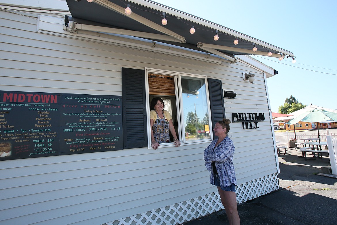 Midtown Drive Up Deli owner Mikele Williams visits with employee Lori Nirk’s daughter, Amanda Flom, before opening for the day. Midtown is in the southeast corner of the My Favorite Things parking lot on Seltice Way in Post Falls.