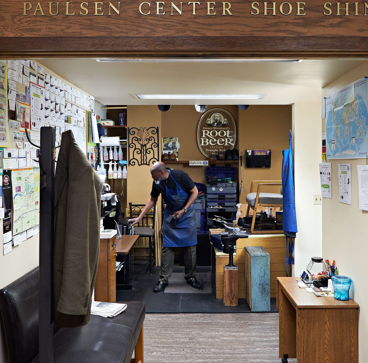 Michael Wilson prepares for his next customer in his shoe repair and shine business inside the Paulsen Center.