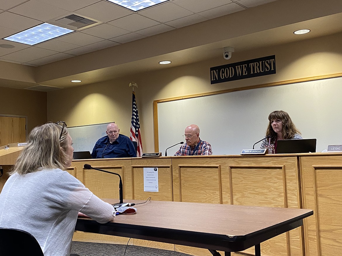 Kootenai County Commissioners listen to Panhandle Health District Director Lora Whalen talk about the North Idaho State Fair at their meeting Tuesday. From left, Bill Brooks, Chris Fillios and Leslie Duncan.