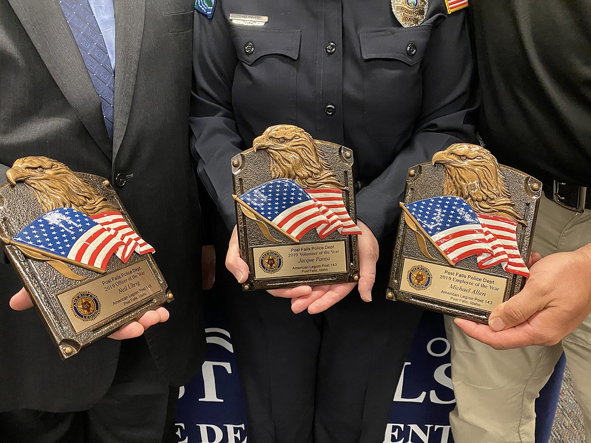 Award winner show off their commemorative plaques after the celebration. (MADISON HARDY/Press)