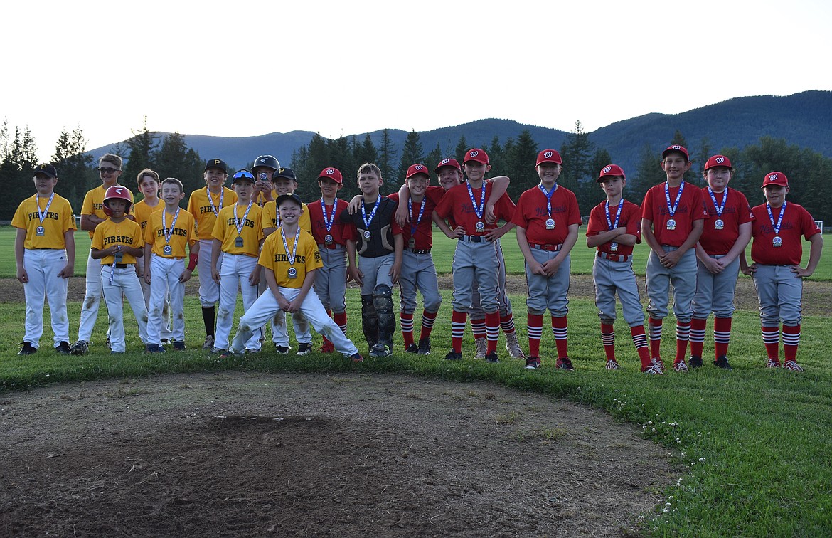 The No. 1 seed Nationals, right, pose for a photo with the No. 2 seed Pirates following the Sandpoint Little League Majors championship on Thursday at Travers Park. The Nats fought off a late surge by the Pirates to win 11-6.