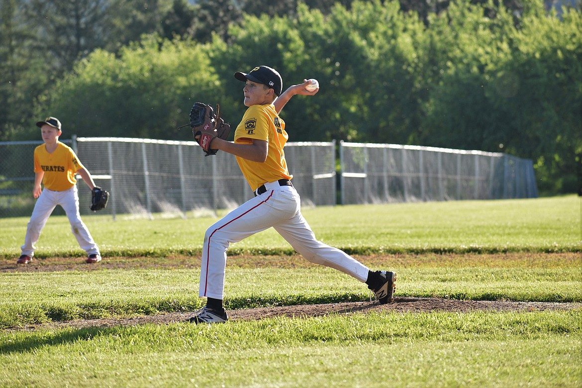A Pirates player pitches the ball during Thursday’s championship game.