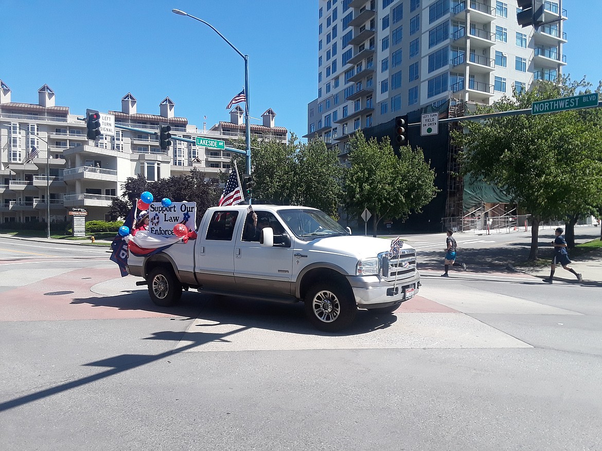 This truckload of supporters cheered on law enforcement during Saturday's Peoples Rights parade. Locals came out to celebrate the 4th of July however they could after the Coeur d'Alene Chamber of Commerce cancelled this year's festivities. (CRAIG NORTHRUP/Press)