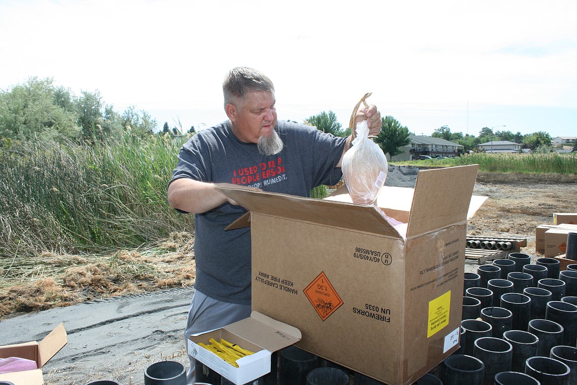 Andrew Allsbrook unloads a fireworks shell. Allsbrook and other members of his family were setting up the 2020 Freedom Festival fireworks show July 4.
