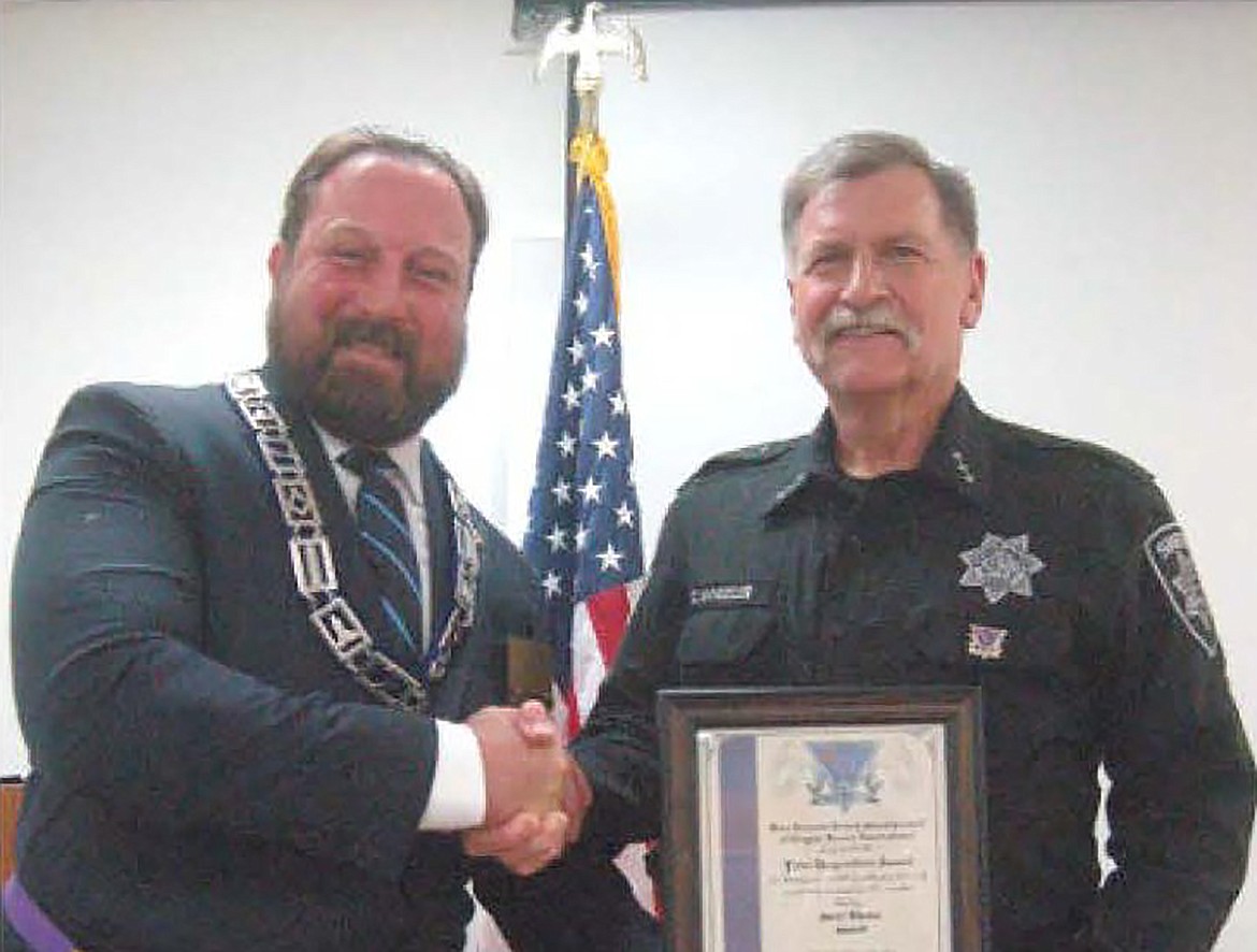 Loren Knight, 12th District Deputy Grand Master for the Idaho Freemasons, on behalf of the General Grand Council of Cryptic Masons International, presented a First Responders Award and pin to Bonner County Sheriff Daryl Wheeler “for preserving life and liberty within our community and providing an example for all as a vocation.”