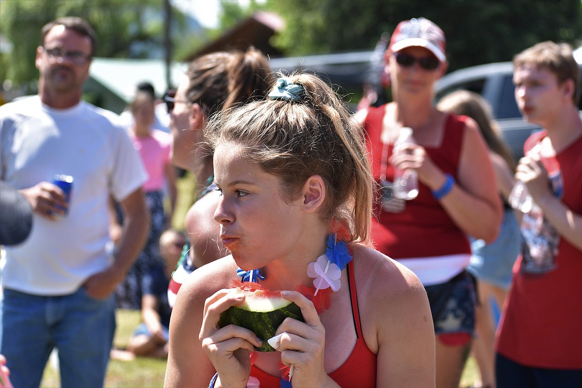 (Photo by DYLAN GREENE) 
 A girl stares down her competition during the watermelon eating contest.