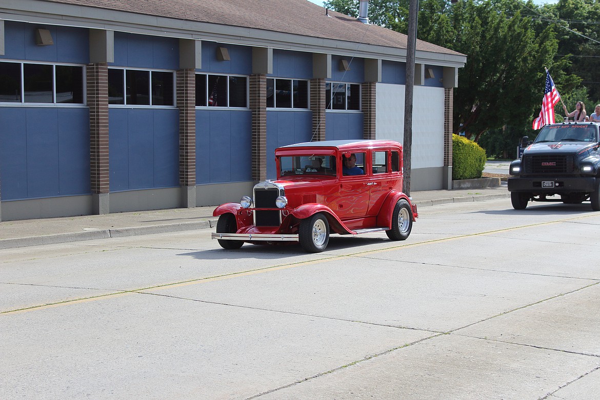 (Photo by VICTOR CORRAL MARTINEZ) 
 Bonners Ferry residents take part in a community parade on the Fourth of July.