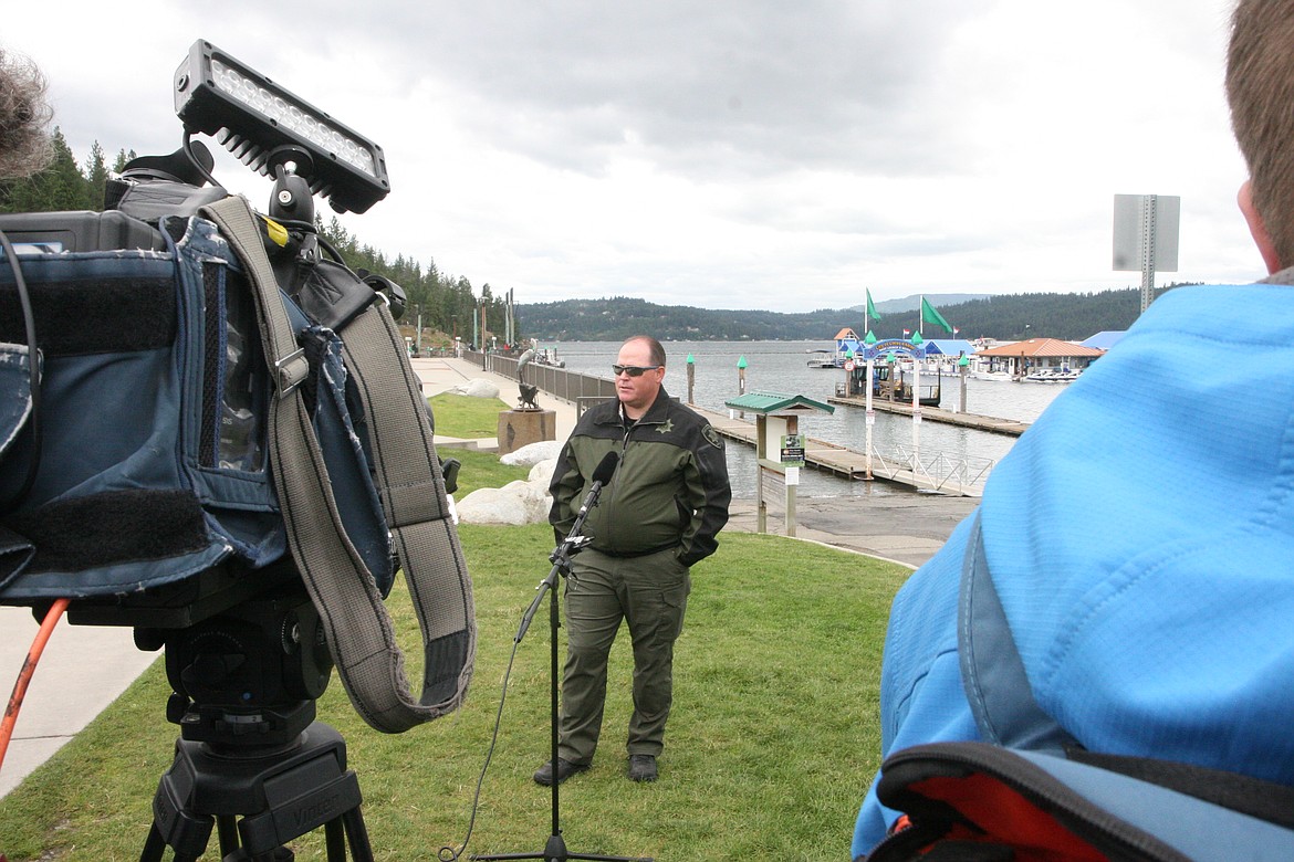 BILL BULEY/Press
Kootenai County Sheriff’s Office Lt. Ryan Higgins speaks to the media Tuesday near Lake Coeur d’Alene.