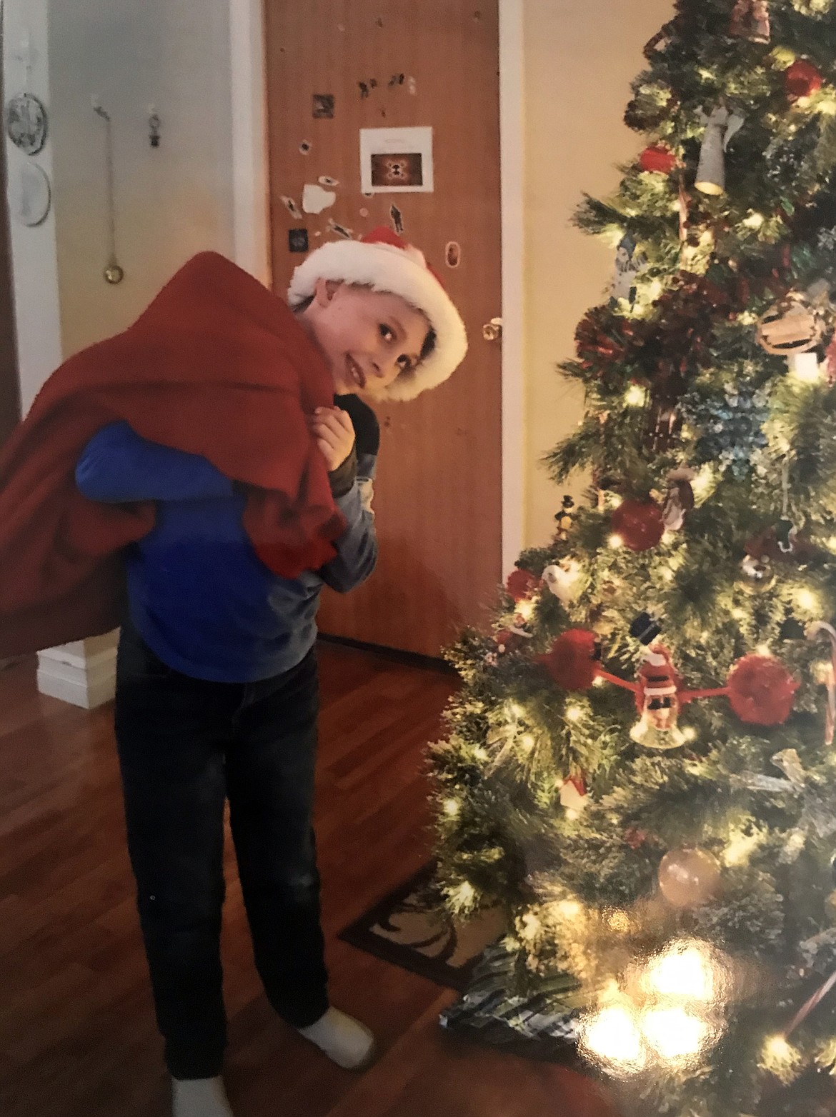 Aiden “Den” Dyer takes his turn as Santa Claus in a recent photo. Dyer was selected as the recipient of Jacey’s Race, which is taking place Sunday, in person and virtually with the course open from 8 a.m. to noon with a running start.