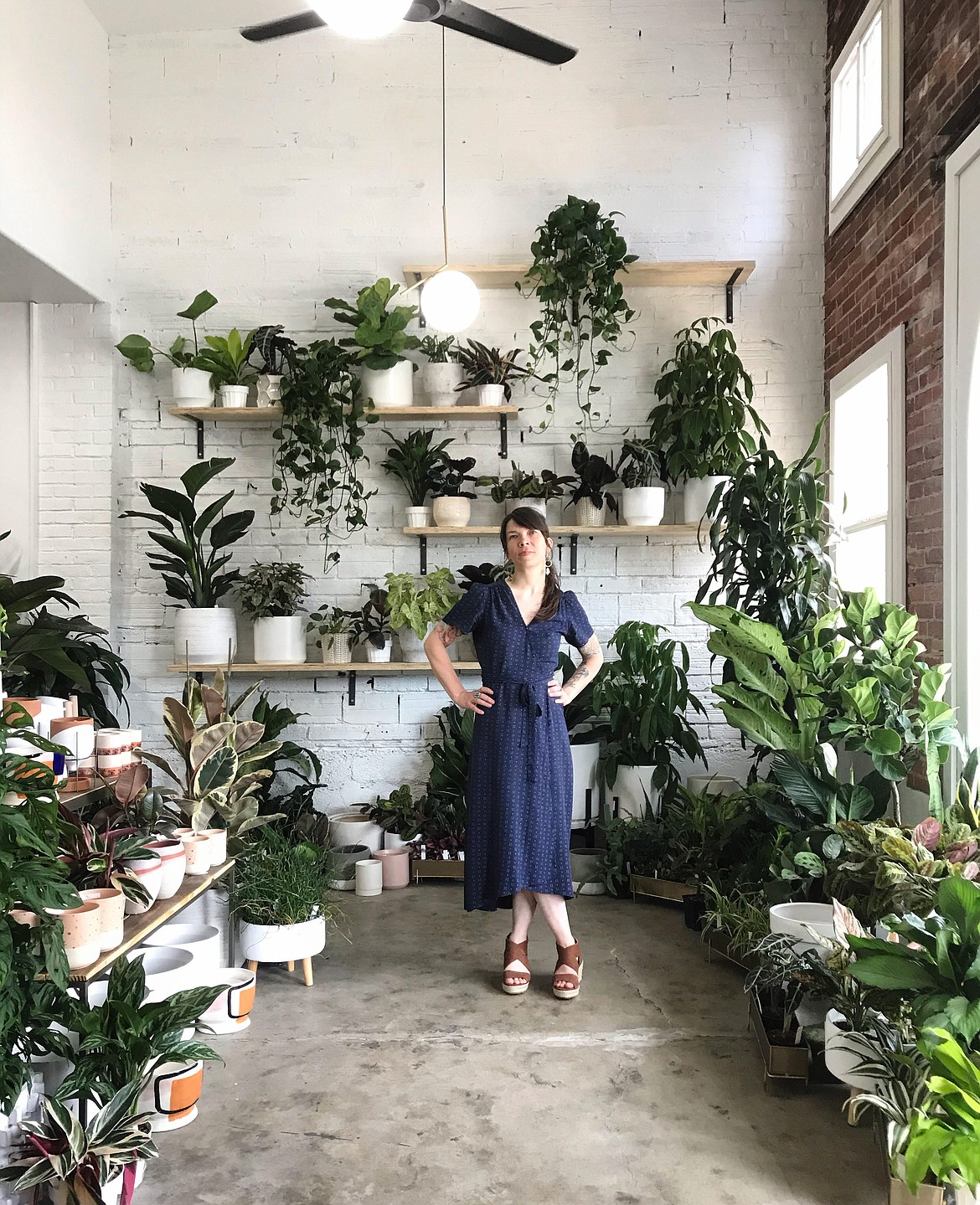 Amy Dolomont is pictured inside the Fern plant shop, located in the newly remodeled building at 211 E. Lakeside Ave.